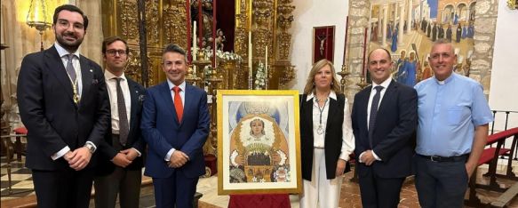 Miembros de la Hermandad junto al creador del cartel en la Iglesia de Santa María La Mayor. // Hermandad de la Aurora Ronda. 